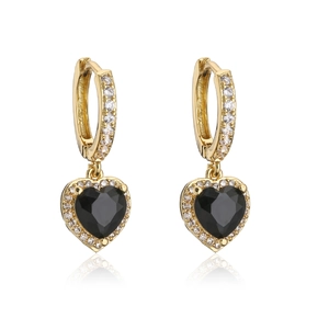 Detailed close-up of gold heart earrings with black stone and pave zircon accents