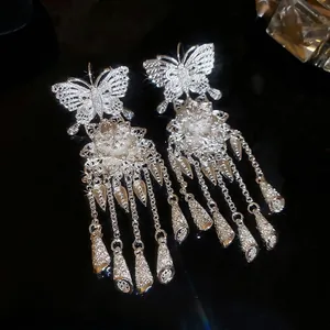 Silver hollow butterfly flower tassel earrings with long metallic fringe drops