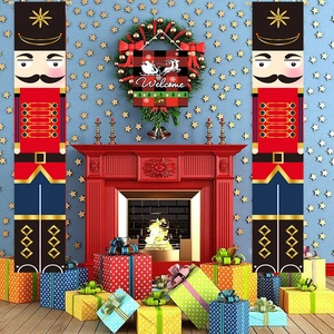 Festive Nutcracker soldier door banners set against a blue starry background with a red fireplace