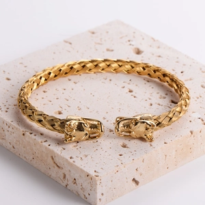 18k gold plated stainless steel twisted wire cuff bracelet with detailed dragon heads