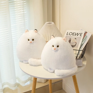 Fluffy white Persian cat plush toys sitting on a table in a cozy home setting