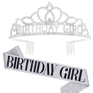 Close-up of sparkling silver rhinestone crown and birthday girl sash for parties