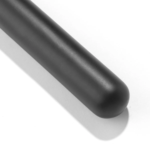Detail shot of the matte black handle of a professional makeup brush with soft bristles