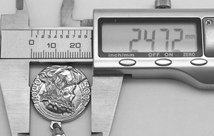Macro view of 24.72mm diameter measuring silver Ecce Homo religious round pendant