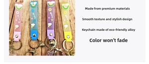 Detail of eco-friendly alloy hook and colorful embossed wish strap on rabbit keychain