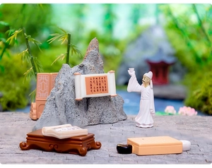 Detailed Zen miniature set with Li Bai figure, faux rockery, and ancient scroll desk