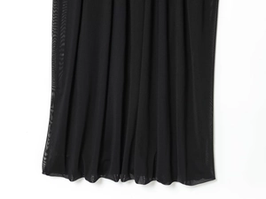 Detailed view of the layered black mesh tulle fabric and fine mesh texture of the dress