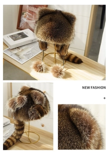 Detail shot of the raccoon-style faux fur hat with long tail and soft plush ears