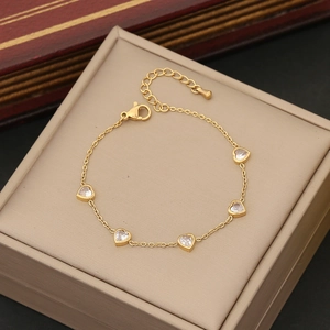 Elegant gold stainless steel bracelet with five heart-shaped crystals and lobster clasp