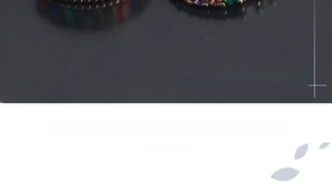 Detailed close-up showing colorful cubic zirconia stones with handmade setting on ring