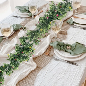 Artificial eucalyptus garland centerpiece with colorful flowers for festive table decor
