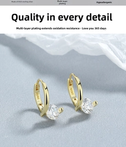 Detail of S925 sterling silver stamp on gold plated hoop earring with zircon stone