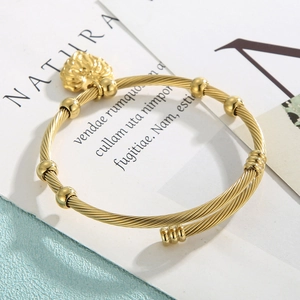 Minimalist golden stainless steel twisted cable open bracelet with heart charm and beads