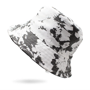 Unisex black and white tie-dye bucket hat with a stylish artistic ink splatter pattern