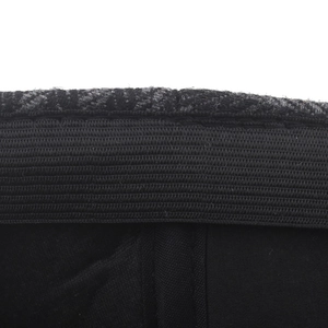 Close-up of the striped beret interior featuring a black elastic sweatband and wool lining