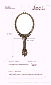 Detailed view of vintage hand mirror with dimensions 25cm x 11.5cm and floral carving
