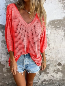 Bright orange V-neck hollow knit sweater for women with loose fit and batwing sleeves