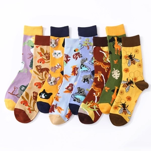 Set of 7 colorful cotton mid-calf socks featuring vibrant animal patterns on white background