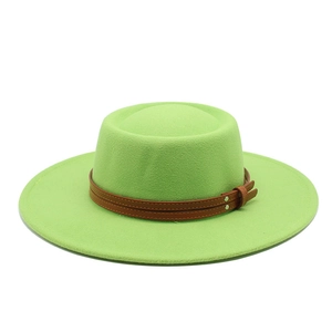 Detail of bright green flat top wool felt hat featuring double brown leather straps