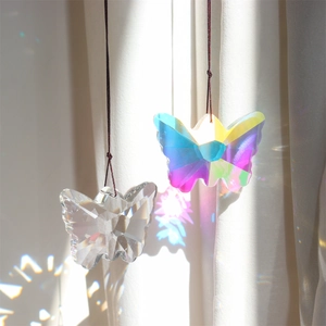 Set of two crystal butterfly prism suncatchers hanging with rainbow light effects