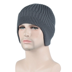Detail view of a dark grey knit beanie with ear flaps on a mannequin head