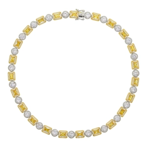 Detail of hip hop necklace with alternating yellow emerald cut and white round zircons