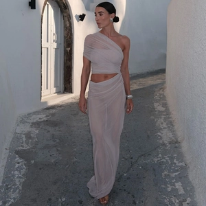 Close-up of light purple mesh two-piece set featuring draped top and side slit skirt