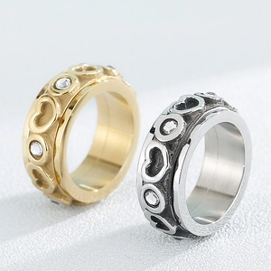 Rotating heart-shaped rings in gold and silver finish with white cubic zirconia inlay