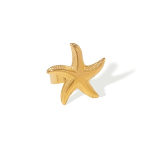 Polished gold starfish open ring in stainless steel with a textured ocean-inspired design