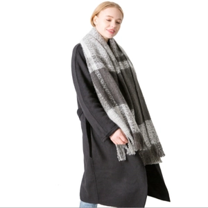 Women's plaid tassel scarf in grey and white check pattern for autumn and winter warmth