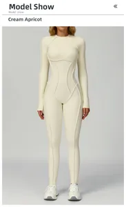 Detail of cream apricot yoga jumpsuit showing ribbed fabric and slim fit seams