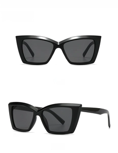 Close-up of modern black square frame sunglasses with thick temples and dark lenses