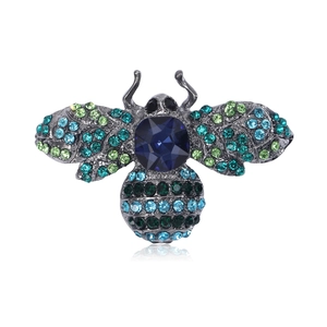 Vintage bee brooch with blue and green crystals on dark grey metal, main front view