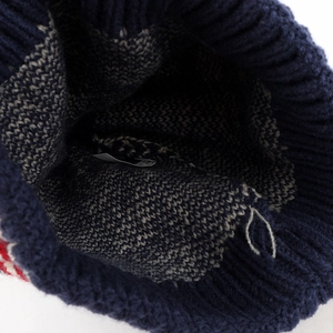 Detail view of ethnic pattern knit hat with thick lining and interior wash label