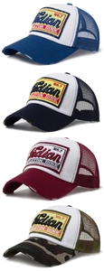 Detail of vintage trucker hats with mesh back and retro embroidered patch set