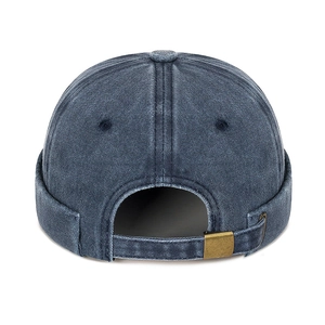 Adjustable dark blue washed cotton docker cap with vintage brass buckle and stitching
