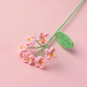 Handmade knitted pink forget-me-not flower bouquet for home decor and gifts
