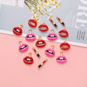 DIY jewelry charms featuring red and pink enamel lips and lipstick with rhinestones