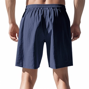 Rear view of men's navy blue linen shorts featuring an elastic waistband and relaxed fit