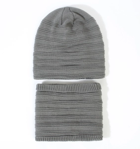 Gray knitted winter set featuring beanie and neck warmer with ribbed stripe texture