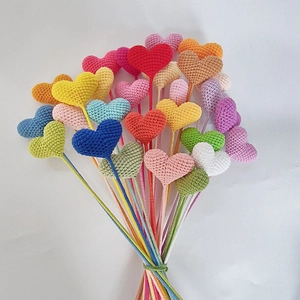 Handmade crochet colorful heart flower bouquet on a pure white background