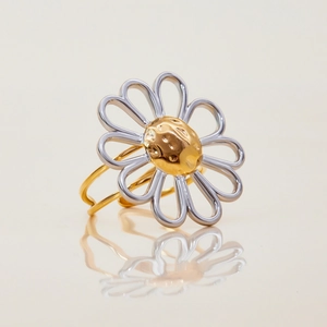 Elegant two-tone daisy flower ring in gold and silver stainless steel with mirror reflection