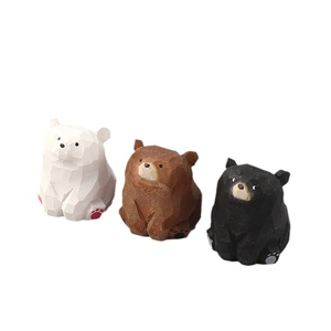 Set of three handcrafted wooden bear figurines in white brown and black for desk decor
