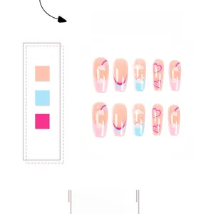Detailed view of long coffin press-on nails with rainbow and heart patterns