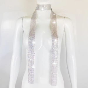 Close-up of sparkling silver sequin scarf necklace with rhinestones on a mannequin