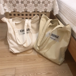 Détails des sacs cabas en toile épaisse avec l'imprimé noir China Bounce Back sur bois