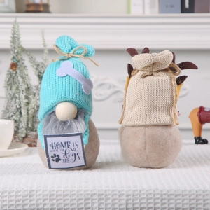 Nordic knitted Christmas gnomes featuring blue hat and reindeer antlers home decor