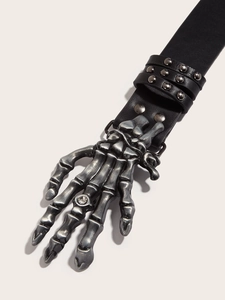 Detail of punk leather belt with silver skull hand buckle and rhinestone accent
