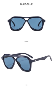 Close-up of blue aviator sunglasses with large frames showing front and side views