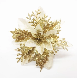 Detail of double-layer artificial Christmas flower with golden glitter and cream petals